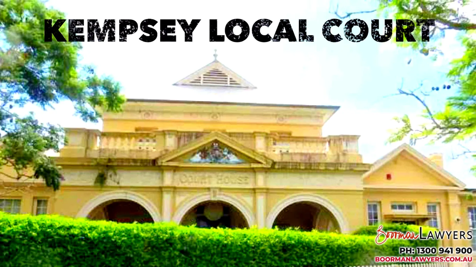 Kempsey Local Court, a two-storey cream courthouse with arched entrances and 'Court House' across the front, with the Boorman Lawyers logo and phone number 1300 941 900