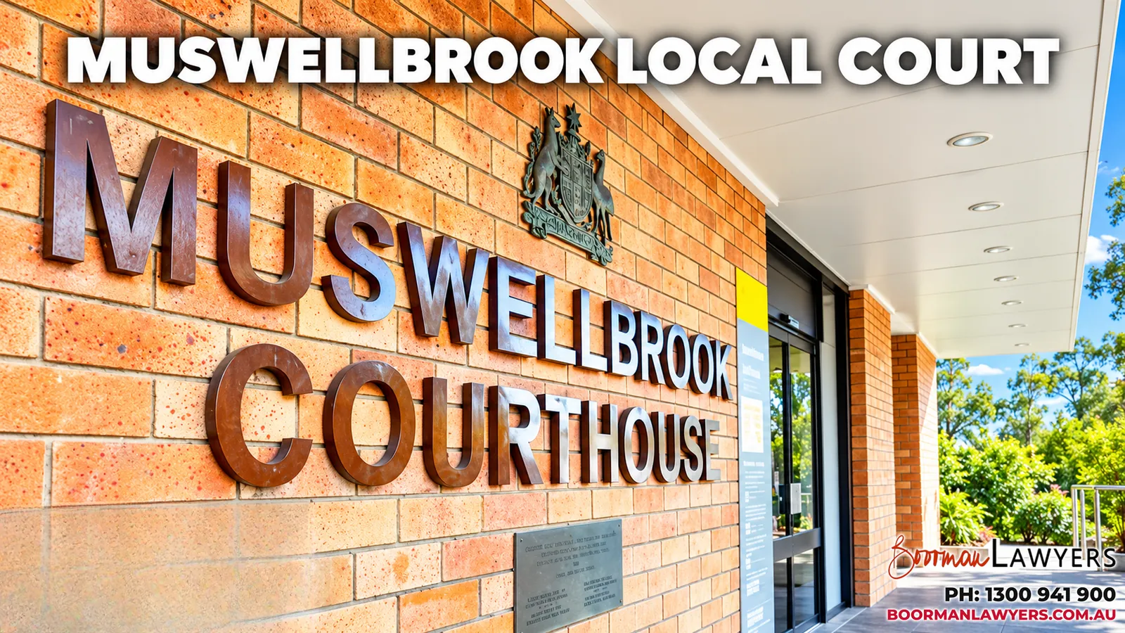 Muswellbrook Courthouse entrance, a brick wall with large metal 'Muswellbrook Courthouse' lettering and a coat of arms, with the Boorman Lawyers logo and phone number 1300 941 900