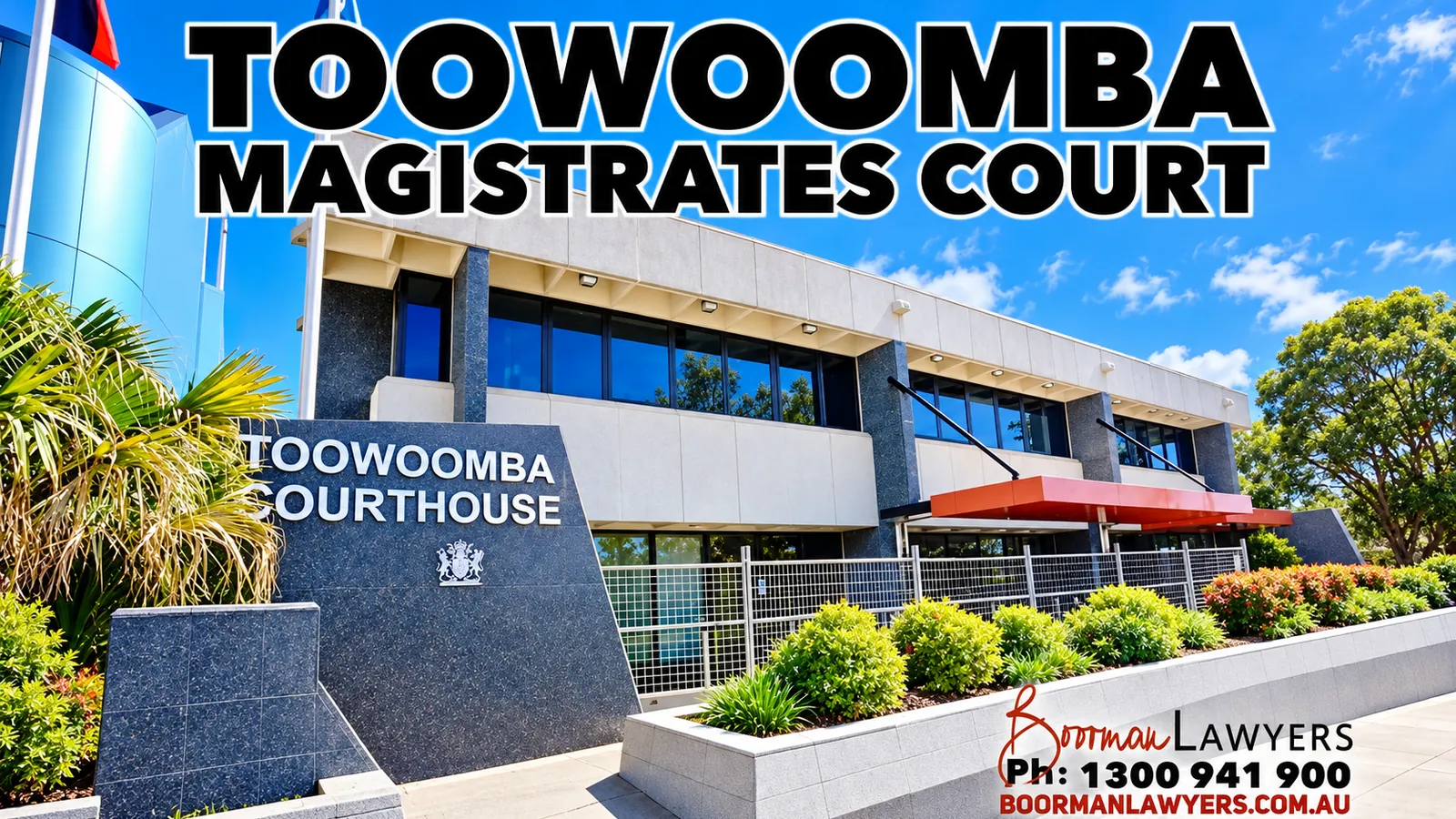 Toowoomba Courthouse, a two-storey grey and white building behind a granite Toowoomba Courthouse sign with the Queensland coat of arms and a garden bed, with the Boorman Lawyers logo and phone number 1300 941 900