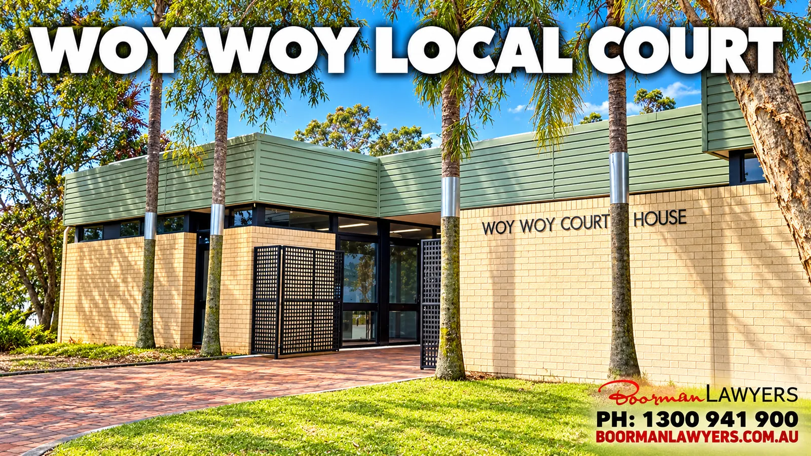 Woy Woy Court House, a modern low building in cream brick and green cladding with palm trees out the front, with the Boorman Lawyers logo and phone number 1300 941 900